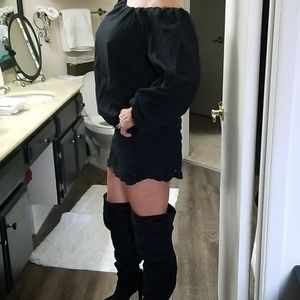 Black off shoulder dress.